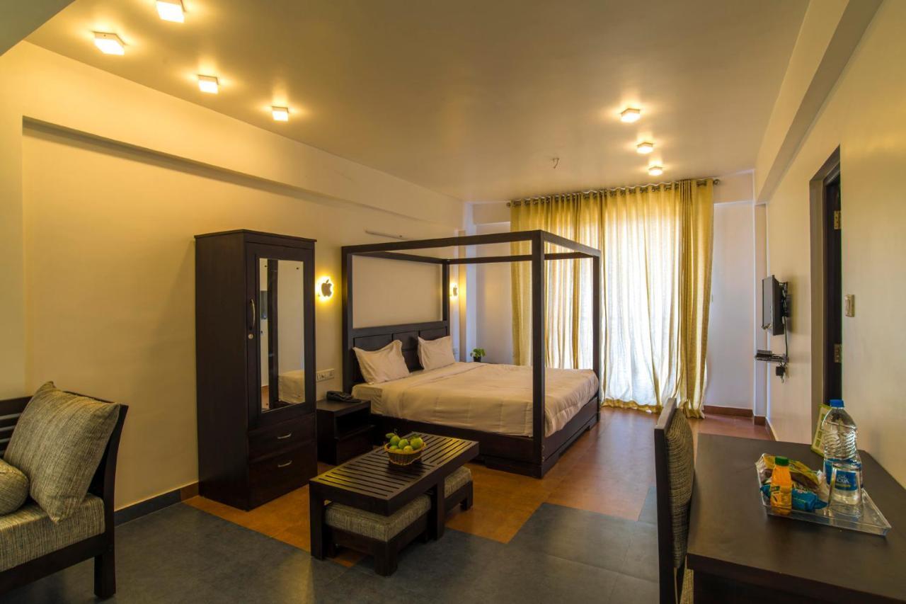Forest County Hotel Мунар Екстериор снимка